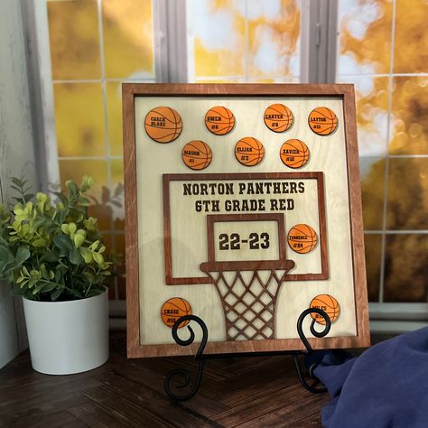 "These fun custom appreciation gift for basketball coach 3d sign are great way to remember the players from these season.  This unique coach gift is made from 3 layers of plywood that is laser cut and engraved with a layer of acrylic to give it a nice touch.  The end of the season thank you coach gift is great way for the kids to say thank you for all you have done this season coach.   Item Details:  -10.25 x 11.75\"  -Plywood and clear acrylic -Stain -Matte finish -Laser engraved and cut  **Each sign can be slight different in colors due to each piece of wood is different.  This is what makes each one unique and special in it's on way.   How To Order: Ordering is very easy, just add your sign to your cart then in the personalizaiton box add the names of player, coach and team for your sig Basketball Gifts Cricut, End Of Season Basketball Gifts For Players, Gifts For Coaches Basketball, Basketball End Of Season Gifts, Coach Gifts Basketball, End Of Season Basketball Gifts Kids, Basketball Coach Gift Ideas, Coach Gift, Basketball Signs