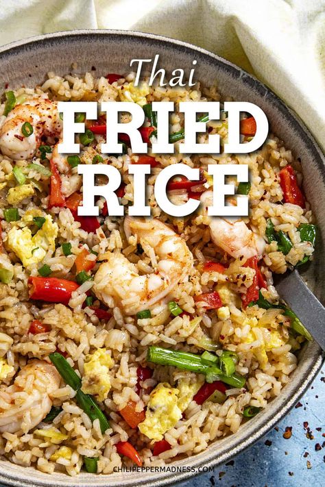 This Thai fried rice recipe is spicy and easy to make with rice quickly stir fried with chilies, scrambled eggs, and shrimp in a simple but flavorful sauce. Singapore Fried Rice Recipe, Thai Spicy Fried Rice, Thai Rice Recipes, Mixed Seafood Fried Rice, Shrimp Marinade For Fried Rice, Singapore Fried Rice, Thai Basil Fried Rice With Shrimp, Shrimp Fried Rice Recipe With Bean Sprouts, Shrimp Fried Rice Recipe