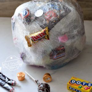 Candy Ball Game, Plastic Wrap Ball, Gift Wrap Game, Family Easter Games, Saran Wrap Ball Game, Christmas Party Games For Groups, Willy Wonka Party, Fun Halloween Party Games, Thanksgiving Games For Kids