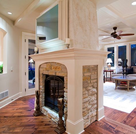 double-sided fireplace.  wood trim around the stone... Double Fireplace, Two Sided Fireplace, Traditional Family Room, Traditional Dining Rooms, Double Sided Fireplace, Tuscan Design, Lots Of Windows, Hearth Room, Fireplace Remodel