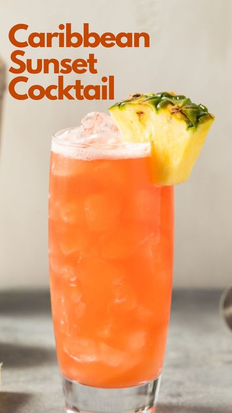 Do you dream of relaxing on a Caribbean beach, watching the sun nestle behind the captivating ocean, but are stuck in any place but there? Then a Caribbean Sunset cocktail may be the answer to your dream. This incredibly light rum drink is effortless to make. Just combine your favorite coconut rum with pineapple juice, a dash of lime juice, and grenadine for aesthetics, and off you drift into your tropical fantasy. #CaribbeanSunsetCocktail Light Liquor Drinks, Pineapple Drinks Alcohol, Carribean Cocktails, Caribbean Drinks Nonalcoholic, Tropical Drinks Recipes Alcohol, Light Rum Drinks, Sunset Drinks, Caribbean Cocktails, Coconut Rum Drinks Recipes