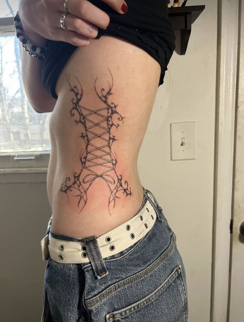 abstract tattoo lace up tattoo Misfits Tattoo, Corset Tattoo, Cute Tats, Wicked Tattoos, Black Tattoo, Side Tattoos, Tattoo Art Drawings, Wings Tattoo, Baby Tattoos