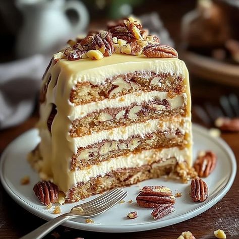 Irresistible White Chocolate Pecan Layer Cake  | A Decadent Dessert You Won’t Forget!   This indulgent cake combines the richness of white chocolate, the crunch of pecans, and fluffy layers topped with a velvety cream frosting and drizzled with white chocolate ganache. A showstopper for any occasion!  Ingredients:  2½ cups all-purpose flour  2½ tsp baking powder  ½ tsp salt  1 cup unsalted butter, softened  1½ cups granulated sugar  4 large eggs  1 cup whole milk  2 tsp... #delicious #Cake Pecan Layer Cake, Cakes Fillings, Baked Meatloaf, Fluffy Layers, Chocolate Strawberry Cheesecake, Pumpkin Spice Bread, Mexican Casserole Recipe, Whipped Cream Frosting, White Chocolate Ganache