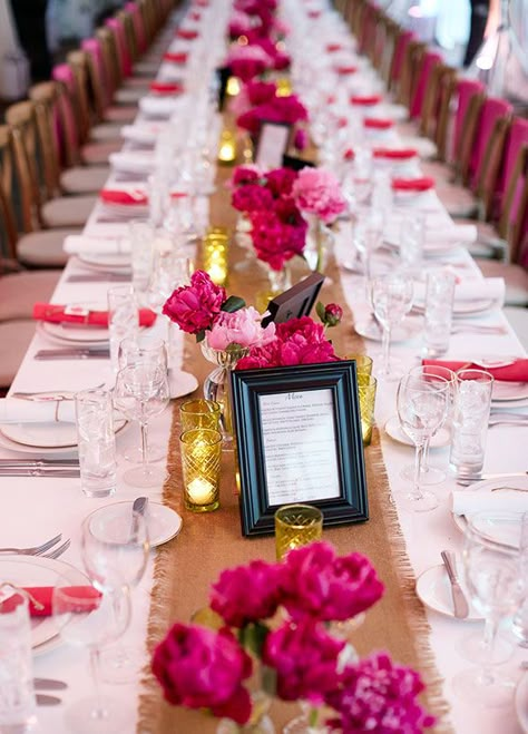 Stunning arrangements of pink peonies in bud vases lined this long dinner table, dressed with a crisp white linen and frayed burlap runner. Fuschia Wedding Table Decorations, Pink And Red Dinner Table Decor, Pink Rehearsal Dinner, Centerpieces With Flowers, Amazing Wedding Centerpieces, Low Wedding Centerpieces, Pink Table Settings, Burlap Runner, Colin Cowie Wedding