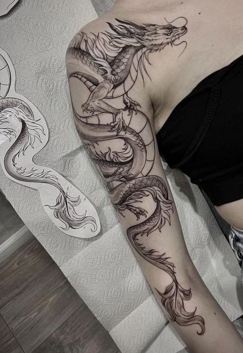 Around The Arm Dragon Tattoo, Dragon Arm Tattoo Wrap, Women Upper Arm Tattoo Ideas, Dragon Arm Tattoo Women, Dragon Tattoos On Arm, Dragon Wrapped Around Leg Tattoo, Dragon Wrapped Around Arm Tattoo, Dragon Tattoo Around Arm, Arm Dragon Tattoo