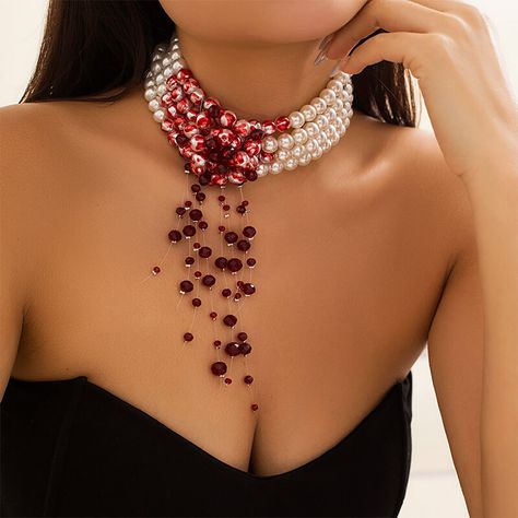 Step into the realm of darkness with our Bloody Pearl Necklace Vampire Goth Aesthetic Jewelry. This stunning piece is crafted to exude elegance with a touch of macabre, perfect for those who embrace goth style and vampire aesthetics. Made from high-quality faux crystal, dripping blood, and imitation pearls material, this necklace is sure to make a statement. Free shipping in the US and worldwide. Elevate your style with a necklace that's both captivating and bold. The Bloody Pearl Necklace features intricate details, including dripping blood accents and faux pearls, adding a mystical allure to any outfit. Gothic Elegance: Embrace your dark side with this striking necklace, designed to complement goth style and vampire aesthetics effortlessly. High-Quality Materials: Crafted from premium fa Vampire Goth Aesthetic, Blood Necklace, Vampire Wedding, Vampire Necklace, Vampire Jewelry, Vampire Clothes, Goth Vintage, Cosplay Jewelry, Vampire Goth