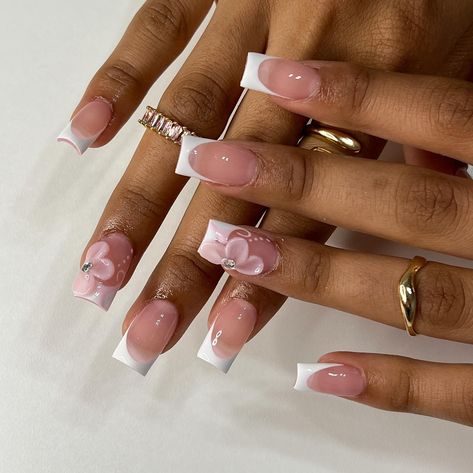 🌸 • • • • #nailsxkay #nailsnailsnails #apresnails #gelx #gelxnails #prettynails #trendynails #naildesign #nailart #nailextentions #bombnails #cutenails #baddienails #nailinspo #pinterestnails #trendynails #explore #explorepage #scvnails #calinails #LAnails #summernails #nailsofinstagram #LAnailtech #flowernails #frenchtipnails #3dflowernails Square White Nails Design, French Tips Styles, Nails One Finger Design, Polly Gell Nail Designs, White Tip Acrylic Nails With Design, French Tip Acrylic Nails With Flower, Barbados Nail Design, French Tip Nails With Flower Charms, French Tip With 3d Flower