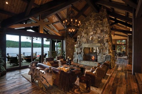 Living room with stone walk-through fireplace and a view of the lake See Thru Fireplace, Casa Vintage, Mansions For Sale, Expensive Houses, House Interiors, Rustic Living, Rustic Living Room, Stone Fireplace, Custom Home Builders