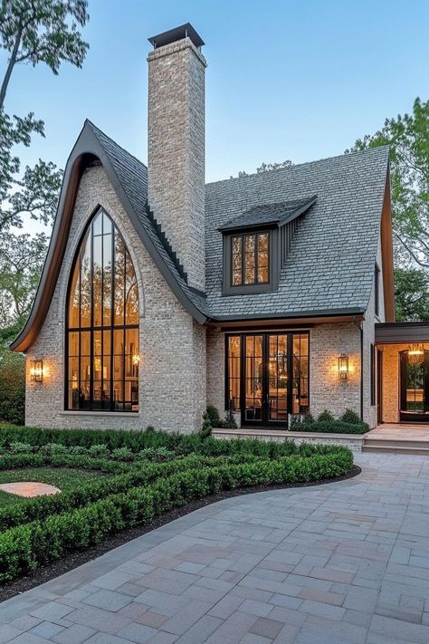 58 Contemporary House Exteriors That Are Hot Right Now Modern European Home Exterior, European Home Exterior, Limestone Brick, Modern European Home, European Homes, Arched Front Door, Pitch Roof, Grandma Cottage, Modern Tudor