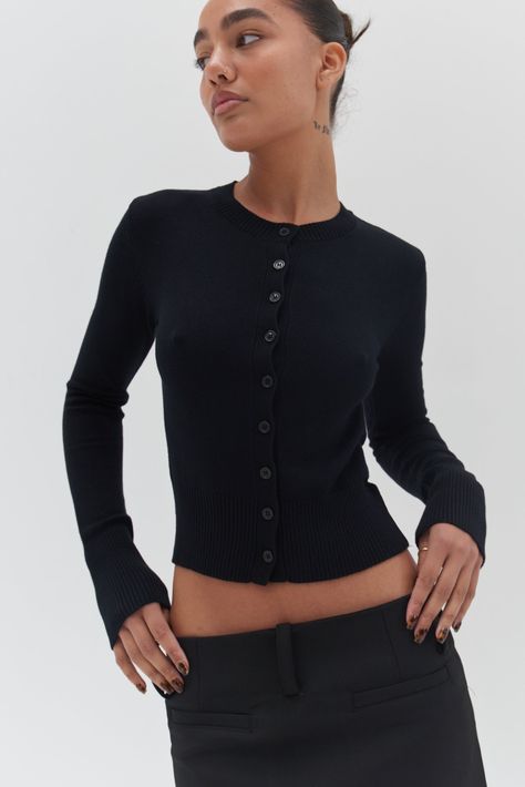 A cozy wardrobe essential! Our Camille Cardigan - Black is crafted from a soft black knit; featuring - a classic button-up front, slightly cropped length and finished with ribbed detailing to the hem, cuffs and neckline Therapist Aesthetic, Cozy Wardrobe, Trendy Fashion Accessories, Cardigan Style, Fitted Cardigan, Elevated Basics, Cardigan Outfits, Cardigan Black, Cardigan Top