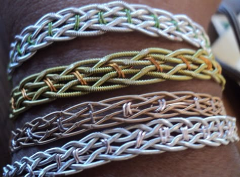 This is one of the first things I made with guitar string. It looks a lot more complicated than it is, it is just two three strand braids, side by side, sewn together with wire. Guitar Picks Crafts, Bracelet Guide, Guitar Craft, Guitar Bracelet, Guitar Crafts, Guitar Jewelry, Guitar String Jewelry, Guitar String Bracelet, Guitar Pick Jewelry