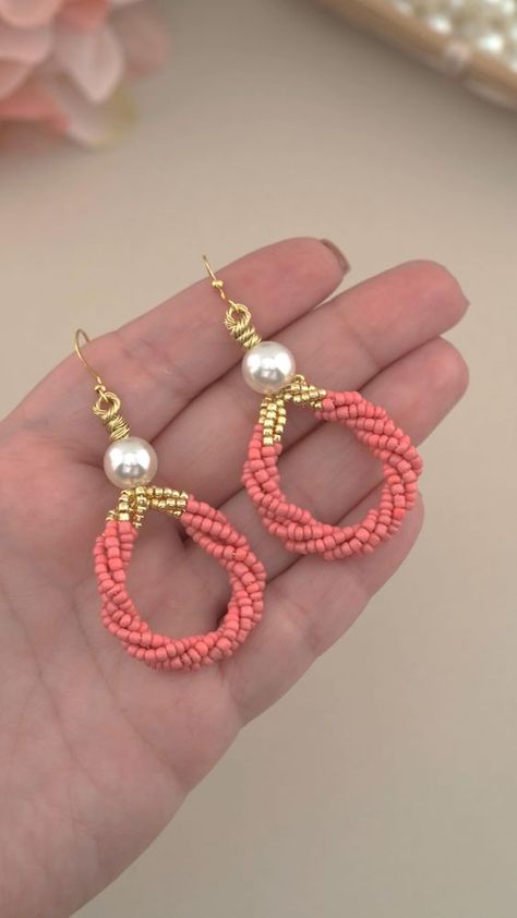 Easy Beaded Earring Design #shortstutorial using Pearls, Seed Beads and Wire: DIY Handmade Gold, Coral Pink Beaded Earrings | Quick & Easy Pearl Wire Wrap Jewelry Design Idea for Beginners.  Gold, Pearl, Coral Pink Seed Bead Earrings Design: Make these Beautiful Beaded Earrings using White Pearls, Pink and Gold Seed Beads and 26 Gauge Wire. Fun & Easy Beading Pattern: Make your own Beaded Earrings at Home.  🔔 Please Like & Subscribe to my YouTube Channel for More Jewelry Tutorials:  @beadlot Earring Design Ideas, Homemade Chandelier, Simple Bead Earrings, Earrings At Home, Diy Earrings Dangle, Pink Beaded Earrings, Easy Beading, Diy Earrings Materials, Diy Earrings Easy