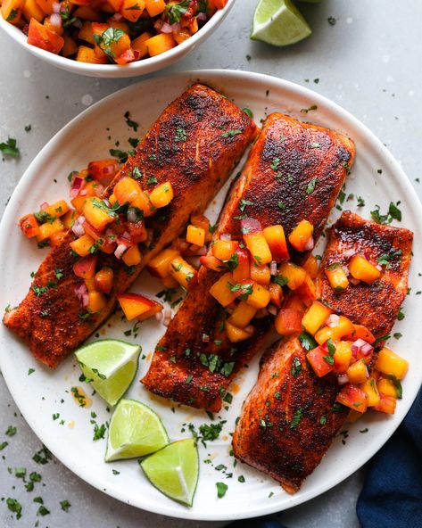 Salmon fillets are rubbed with a smoky chipotle seasoning, baked to perfection and topped with the best homemade peach salsa! They're so easy to make and the perfect blend of sweet and spicy! Chipotle Salmon, Oven Baked Salmon Recipes, Salmon Tacos, Oven Baked Salmon, Salsa Ingredients, Peach Salsa, Shrimp Ceviche, Cilantro Lime Dressing, Baked Salmon Recipes