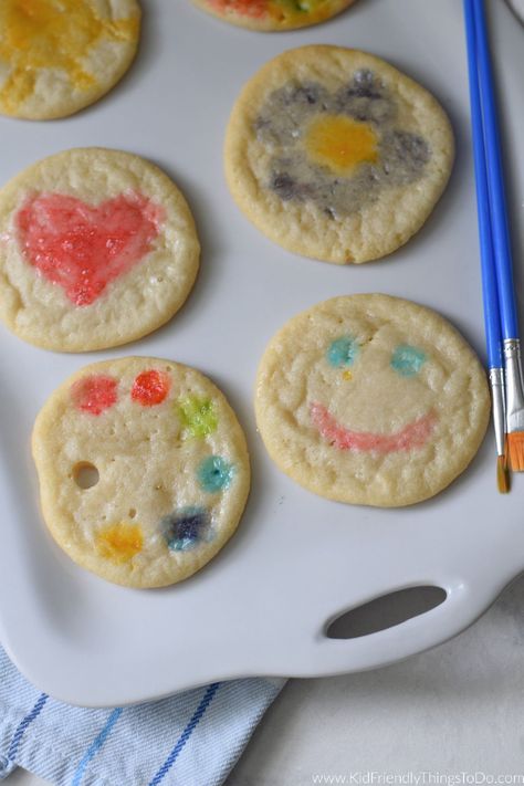 Painting Sugar Cookies with egg whites is a fun technique for decorating cookies with the kids. Follow my easy tutorial on Painting Cookies Using Egg Whites. Have fun decorating cookies at your birthday parties and this holiday season. Cookie Decorating For Toddlers, Painting Sugar Cookies, Edible Paint For Cookies, Cookies With Egg Whites, Painting Cookies, Painted Sugar Cookies, Egg Yoke, Christmas Sleepover, Watercolor Cookies