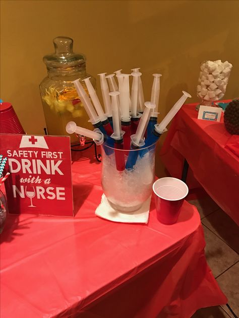 Safety first, drink with a nurse. Jell-O shots and hunch punch! Jello syringes purchased on Amazon!  #nursingparty #nursinggraduation #rn Nurse Cocktail Ideas, Graduation Jello Shots, Syringe Shots Party Ideas, Nurse Theme Alcohol Drinks, Nurse Drinks, Jello Shots In A Syringe, Nursing School Graduation Party Ideas Jello Shots, Shots In Syringes Parties, Syringe Shots