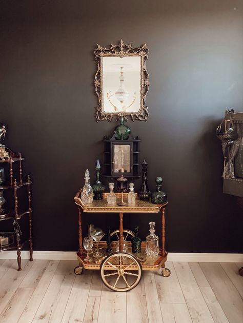 Gothic Bar Cart, Dark Home Design, Antique Bar Cart, Antique Bar Carts, Gothic Bar, Academia Interior, Black Gold Decor, Bar Cart Inspo, Dark Academia Interior