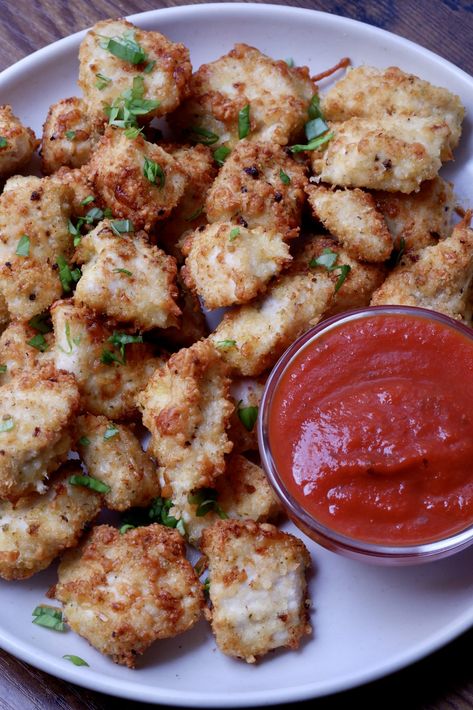 These chicken parmesan bites are the perfect crispy, cheesy nuggets. Serve with red sauce for a fun take on chicken parmesan! Chicken Parm Bites Air Fryer, Chicken Parm Nuggets, Chicken Parmesan Bites Air Fryer, Parmesan Crusted Chicken Bites, Chicken Nugget Parmesan, Chicken Parm Bites, Chicken Parmesan Bites, Parmesan Chicken Bites, Parmesan Bites