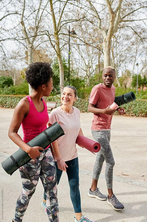 Diverse group of fit friends in sportswear talking together while walking along a path in a park after an outdoor yoga class Yoga In The Park, Cloud Shoot, Friends Walking Together, Yoga With Friends, Outdoor Event Ideas, Workout Friends, Walking Group, Start Yoga, Friends Talking