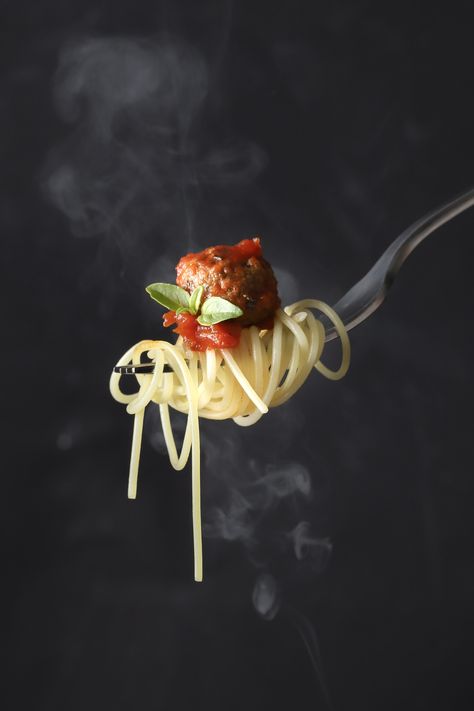 Pasta with meatballs and tomato sauce on a fork, black background Pasta With Meatballs, Pasta Ideas, Food Creatives, Meatball Pasta, Dark Food Photography, Wise Guys, Food Photography Props, Restaurant Photos, Coffee Wallpaper