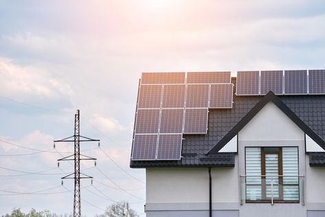 Residential house with rooftop covered with solar photovoltaic panels for producing of clean ecological electrical energy in suburban rural area. Concept of autonomous home. House With Rooftop, Photovoltaic Panels, Improve Energy, Electrical Energy, Solar Energy System, Residential House, Sustainable Energy, Solar Battery, Rural Area