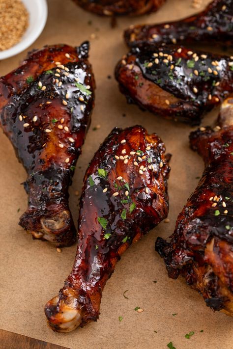 These sweet & sticky baked chicken drumsticks are the perfect appetizer or easy dinner! Tender chicken legs are coated in a sticky, addictive glaze packed with Asian flavors and baked until juicy. These are absolutely the BEST baked drumsticks! How Long To Bake Chicken Drumsticks, Japanese Chicken Drumsticks, Asian Drumsticks Baked, Slow Cooked Chicken Drumsticks, Chicken Legs And Wings Recipes, Marinade For Chicken Legs On The Grill, Chicken Legs Air Fryer Recipes, Sheet Pan Drumsticks, Korean Drumsticks Recipe