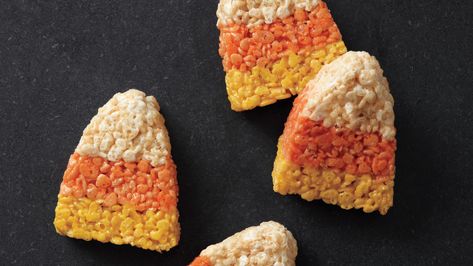 Two Halloween must-haves -- candy corn and cereal treats -- make one festive sweet. The trick? Spike the orange and yellow layers with citrus zest to add bright, unexpected flavor. Candy Corn Rice Krispie Treats, Menu Halloween, Pasteles Halloween, Corn Rice, Halloween Party Snacks, Krispy Treats, Cereal Treats, Halloween Treats Easy, Halloween Sweets