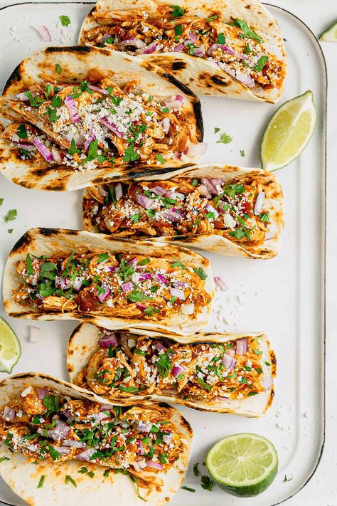 Healthy Slow Cooker Chicken Tacos | Midwest Foodie | With just 5 minutes of prep time, these 5 ingredient slow cooker chicken tacos are healthy, tasty and almost too easy to make! Toss everything in the crock pot, come back a few hours later, shred the chicken and you're ready to sit down for dinner! Pulled Chicken Tacos, Slow Cooker Chicken Healthy, Chicken Crockpot Recipes Healthy, Slow Cooker Shredded Chicken, Easy Taco Recipes, Slow Cooker Chicken Tacos, Shredded Chicken Tacos, Chicken Tacos Crockpot, Chicken Taco Recipes