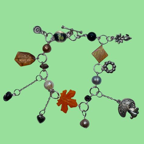 #nature #jewellery #beaded #indie #fairygrunge gardencore lake goblincore earth tones autumn seasons mushie mushroomcore flower power daisy obsidian onyx Garden Stream, 2000s Indie, Pearl Charm Bracelet, Funky Jewelry, Grunge Y2k, Fairy Grunge, Bead Charm Bracelet, Pearl Charms, Brown Orange