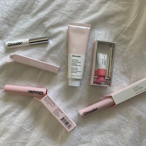 glossier makeup items and packaging scattered across a white sheet
The glossier items are: cloud paint (in shade puff), lash slick, ultralip (in shade portrait), priming moisturiser, and boy brow (in shade brown) Glossier Moisturizer, Glossier Lash Slick, Lash Slick, Cloud Paint, Glossier Cloud Paint, Glossier Makeup, Boy Brow, Priming Moisturizer, Makeup Is Life