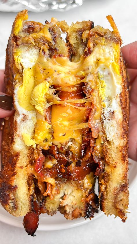 Egg-in-a-hole breakfast sandwich Bacon And Egg Sandwich Recipe, Egg In A Hole Grilled Cheese, Bacon Eggs Recipes, Croissant Bread Sandwich, Ham And Bacon Sandwich, French Bread Breakfast Sandwich, Folded Egg Sandwich, Turkey Egg And Cheese Breakfast Sandwich, Fancy Breakfast Sandwich