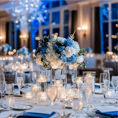 ransform your wedding into a winter wonderland with this stunning blue and white floral decor. The cool tones, paired with soft candlelight, create a magical and sophisticated atmosphere perfect for a winter or evening wedding. From the hydrangea centerpieces to the glowing candlelight, this setup exudes elegance and romance. Save this pin for inspiration on crafting your dream winter wedding reception! #WinterWedding #BlueAndWhiteWedding #WeddingDecor #ElegantWeddings #WeddingInspiration Winter Wonderland Wedding Decorations Wedding Table Decor, Christmas Themed Wedding Centerpieces Winter Wonderland, Winter Wonderland Wedding Reception Table Decor, Winter Wedding Blue And Silver Decor, Navy Blue And Silver Wedding Centerpieces Winter Wonderland, Winter Wonderland Floral Centerpieces, Winter Wonderland Wedding Reception, Winter Wonderland Wedding Centerpieces, Orchid Centerpieces Wedding