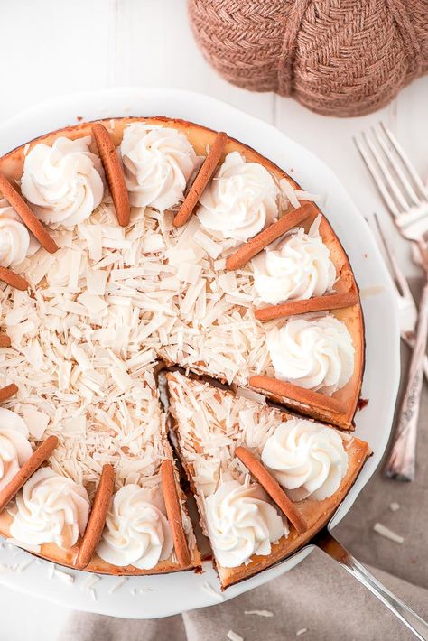 With a silky smooth texture, elegant chocolate shavings, whipped cream, and a gingersnap crust everyone will be making room for dessert when they see this White Chocolate Pumpkin Cheesecake. White Pumpkin Cheesecake, White Chocolate Pumpkin Cheesecake, Cheesecake Garnish, Cheesecake White Chocolate, Chocolate Pumpkin Cheesecake, Gingersnap Crust, Pumpkin Cheesecake Recipes, Fruit Sauce, White Chocolate Cheesecake