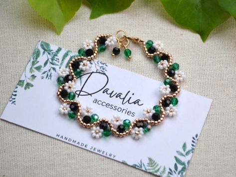 Green and black beaded flower bracelet and anklet, Daisy bracelet, Handmade with crystals and seed beads. Beaded Flower Bracelet, Daisy Bracelet, Flower Bracelet, Bracelet Handmade, Green And Black, Beaded Bracelet, Seed Beads, Daisy, Bracelet