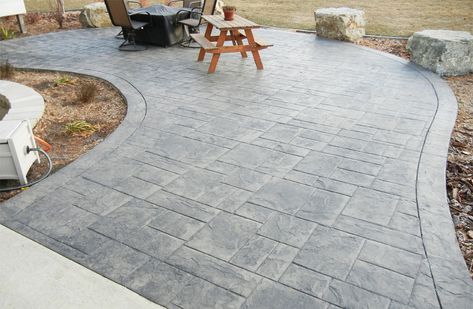 Stamped Patio With Border - Sioux ConcreteSioux Concrete Stamped Concrete With Retaining Wall, Gray Stamped Concrete Patio, Patio With Border, Stamped Patio, Basement Patio, Stamped Concrete Patio Designs, Retaining Wall Patio, Stamped Concrete Walkway, Concrete Basement