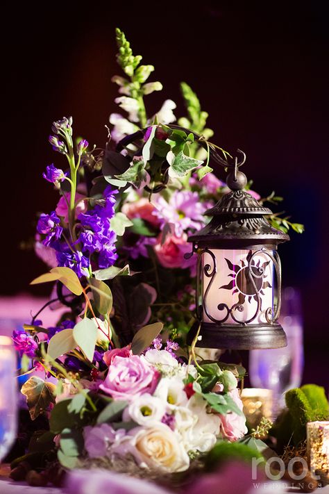 Tangled inspired wedding centerpiece at an Epcot wedding in The Living Seas Salon.  #tangled #tangledwedding #rapunzel  #root_weddings #livingseas #thelivingseas #disneywedding #disneyweddingphotographer #orlandoweddingphotographer Fairytale Wedding Centerpieces, Rapunzel Wedding Theme, Disney Wedding Decorations, Disney Wedding Centerpieces, Rapunzel Wedding, Tangled Wedding, Root Photography, Disney World Wedding, Tangled Birthday