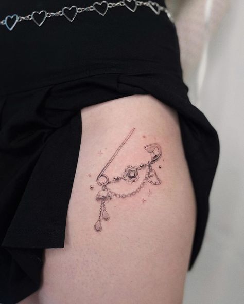 Kiki Raven | Safety pin with beads for Lu-Lu! Thank you so much for trusting me with your first tattoo and for the cute gift 🥺 ✿ follow the rest of… | Instagram Pretty Anime Tattoos, Japanese Good Luck Charm Tattoo, Safety Pin Tattoo Ideas, Le Sserafim Tattoo, Cute Fineline Tattoo, Safety Pin Tattoo Meaning, Paper Clip Tattoo, Safety Pin Ideas, Pin Tattoo Ideas