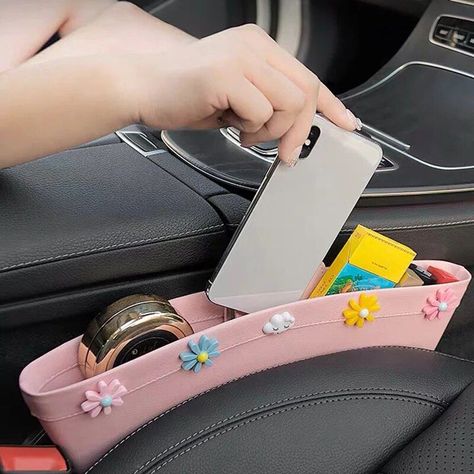 : Keep your car seat tidy and organized with this stylish and functional organizer. Perfect for storing snacks, toys, and other essentials, this organizer is made with durable materials and features a floral design that will add a touch of beauty to your car. #carseatorganizer #carseataccessories #flowers Car Stuff Aesthetic, Diy Car Camping Hacks, Car Interior Diy Ideas, Cute Stuff For Your Car, Fun Car Decor, Teen Car Accessories, Cute Car Essentials, Girl Car Interior Decor, Cute Car Interior Ideas Decor