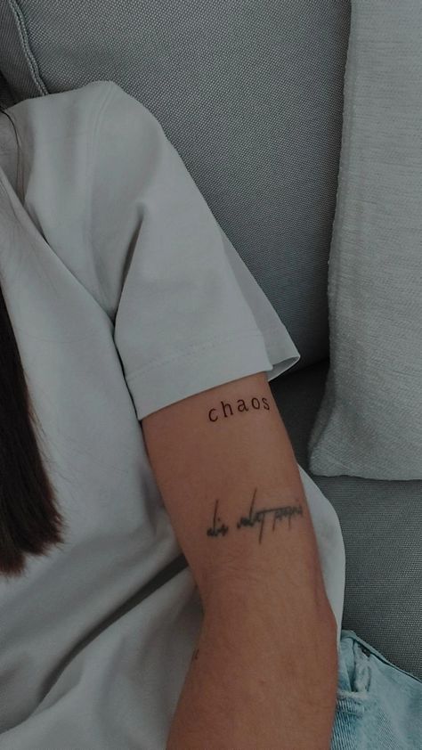 #tattoo #chaos #chaostattoo #word #wordtattoo #tattooidea #girlstattoo Chaos Word Tattoo, Chaos Tattoo Design, Comfort And Chaos Tattoo, Word Arm Tattoo, Lover Tattoo Word, Chaos Tattoo Words, Chaos Tattoo Ideas, Typewriter Font Tattoo, Dreamer Tattoo