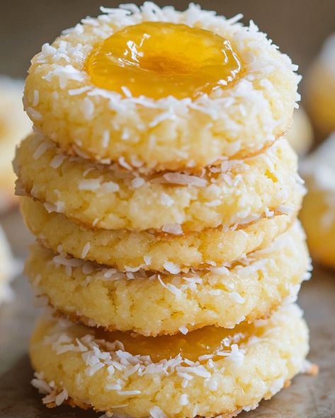 Hello, and Welcome to a Tropical Treat! If you’re craving something tropical and sweet, you’re in the right place! These Coconut Thumbprint Cookies with Pineapple Filling are like a mini-vacation in each bite, featuring a buttery, melt-in-your-mouth cookie with the sunny taste of pineapple nestled in each thumbprint. Pineapple Coconut Thumbprint Cookies, Thumbprint Cookies With Coconut, Coconut Flower Cookies, Hawaiian Christmas Desserts, Tropical Christmas Cookies, Pineapple Cookies Recipes, Pineapple Filled Cookies, Pineapple Upside Down Cookies, Coconut Christmas Cookies