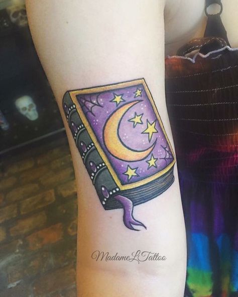 Spell book tattoo 🔮 Spell Book Tattoo Design, Spell Book Tattoo, 90s Tattoos, Charm Tattoo, Halloween Spell Book, Celestial Tattoo, L Tattoo, Sweet Tattoos, Tattoo Videos