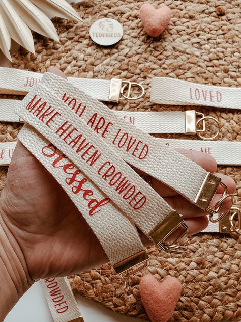 "LOVE Valentines keychains FAITH WRISTLET KEYCHAIN,CANVAS KEY FOB, MOTHERS DAY GIFT, FATHERS DAY GIFT, GIFTS FOR HER, GIFT FOR HIM, PERSONALIZED GIFT IDEA, CUSTOMIZABLE, KEY FOB WRISTLET, KEYFOB KEYCHAIN, CHRISTIAN KEYCHAIN You will receive: ~ A lovely  Wristlet keychain / key fob with the saying or word of your choice from our drop down menu. If you would like to have a custom word, name or saying done, please message us, We love creating special requests! ~ These are off white with Red wording ~ Available in a Gold keychain clasp. ~ Measurements: These are about 6\" long and are about 1\" thick ~ Nicely packaged. These also make great: ~ Gifts ~ Party favors ~ Teacher application gifts ~ Bridesmaids gifts  >> DISCOUNT FOR BULK ORDERS OVER 15 PIECES << Contact us for details. > Custom Req Diy Christian Keychain Ideas, Christian Products, Christian Keychain Ideas, Christian Keychain Aesthetic, Christian Wristlet Keychain, Jesus Keychain, Ministry Gifts, Christian Accessories, Survival Bag