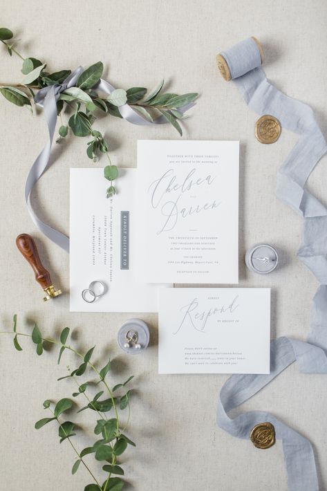 Dusty blue detail shot including eucalyptus greenery, Minted invitations, engagement ring, and earrings  PC Sidney Leigh Photography Dusty Blue Detail Shots, Blue Wedding Flatlay, Blue Wedding Detail Photos, Dusty Blue And Greenery Wedding, Minted Invitations, Invitations Engagement, Wedding Detail Shots, Mood Wedding, Blue White Weddings