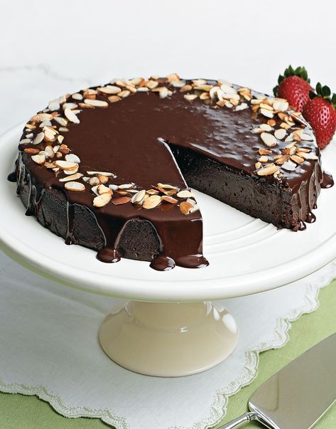 Chocolate-Almond Torte with Ganache Topping | With elegant good looks, creamy texture, sophisticated taste, and simple instructions, this is one chocolate dessert that will leave you with plenty of good cheer. Even better, this five-star Chocolate-Almond Torte is also a great make-ahead dessert. #cuisineathome #cakerecipes #bakingrecipes #dessertrecipes #cakes #cakeideas #food #recipe #chocolate #chocolatedesserts #desserts #dessertrecipes Chocolate Almond Desserts, Cake Almond, Chocolate Almond Cake Decoration, Chocolate Almond Torte, Chocolate Torte Recipe, Simple Chocolate Cake, Almond Meal Chocolate Cake, Chocolate Mousse Cake With Ganache, Almond Cake