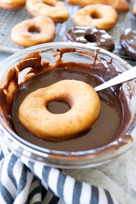 Pillowy donuts topped with silky chocolate glaze? Say less. You can't stop the audible ‘Mmm’ when you bite into these chocolate glazed donuts. This recipe pairs the softest and most tender homemade donut with an out-of-this-world chocolate glaze that is bound to satisfy even the pickiest connoisseur. | how to mnake donuts at home | homemade donuts recipe easy | chocolate glazed donuts recipe | how to make chocolate donut glaze | donuts from scratch easy |  best chocolate donut recipe Chocolate Glaze For Donuts Recipe, Chocolate Donut Frosting, Homemade Donuts Recipe Easy, Chocolate Donut Glaze, Donuts Recipe Easy, Chocolate Glazed Donuts Recipe, Chocolate Donut Recipe, Donut Recipe Fried, Glazed Donuts Recipe