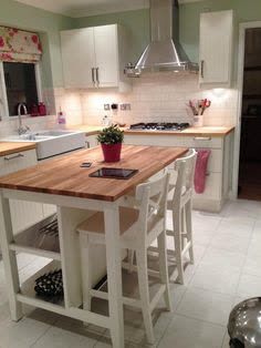 This contains an image of: Kitchen Island Storage, Ikea Kitchen Island, Modern Kitchen Island, Kitchen Island With Seating, Diy Kitchen Island, Island With Seating, Chic Kitchen, Shabby Chic Kitchen, Apartment Kitchen