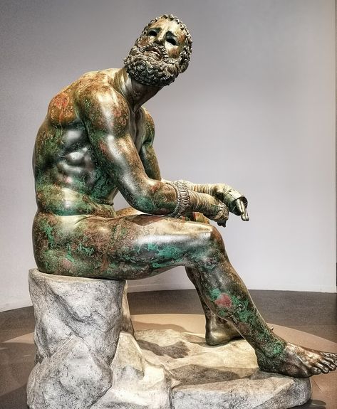 Take a look at one of the most penetrating psychological portraits in the story of art: the ancient Hellenistic sculpture "The Boxer at Rest" in Rome's Palazzo Massimo. Read to discover why the battered ancient pugilist is one of our our favourite antique masterpieces in Rome, and why you need to join us on a Virtual Tour of the incredible but underrated Palazzo Massimo! Link to the tour is within the blog page! Boxer At Rest, Hellenistic Period, Concrete Statues, Classic Sculpture, Greek Statues, Antique Sculpture, Empire Romain, Ancient Statues, The Boxer