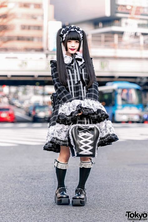 Gothic twin-tailed Japanese girl clad in a checkered dress, lace headdress, knee socks, lace-up shoes and carrying two bags while out and about on the Harajuku street. Mode Harajuku, Lolita Outfits, Tokyo Street Style, Streetwear Mode, Baby The Stars Shine Bright, Bow Bag, Ootd Ideas, Checkered Dress, Tokyo Fashion