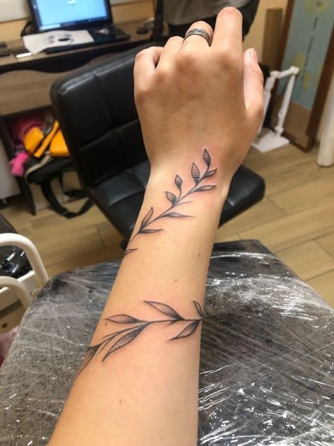 Leaf Wrap Around Tattoo Arm With Butterfly, Rap Around Vine Tattoo, Vine Wrist Wrap Tattoos For Women, Rap Around Vine Tattoo Arm, Barb Wire Forearm Tattoo, Fine Line Leaves Tattoo Arm, Leaf Wrap Around Tattoo Forearm, Dainty Vine Tattoo Arm, Leaf Wrapped Around Arm Tattoo