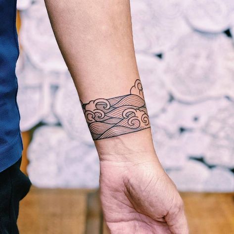 35+ Exquisite Line Art Tattoo Ideas Line Art Waves Tattoo, Wave Tattoo Around Wrist, Waves Arm Tattoo, Armband Pattern Tattoo, Water Arm Band Tattoo, Ocean Wave Tattoo Sleeve, Beach Band Tattoo, Line Art Leg Tattoo, Arm Band Tattoo Waves