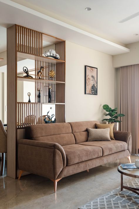 Apartment at Sheetal West Park | Prashant Parmar Architect – Shayona Consultant Wood Wall Separation, Sofa Partition Design, Bookcase Partition Wall, Wooden Partition Design Living Rooms, Scandinavian Coastal Interior, Hall Partition Living Rooms, Living Dining Partition, Living Partition, Living Room Partition Ideas